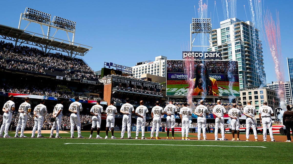 San Diego Padres players standing for the national anthem at Petco Park.