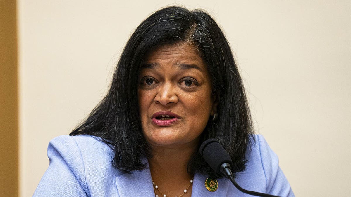 Rep. Pramila Jayapal speaking at a podium