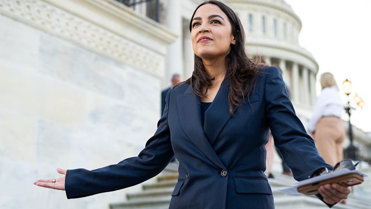 Rep. Alexandria Ocasio-Cortez speaking with reporters on House steps
