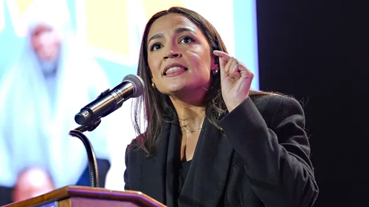 Rep. Alexandria Ocasio-Cortez speaking at a rally at Forest Hills Stadium