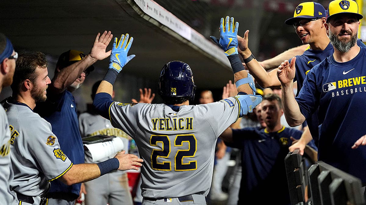 Christian Yelich celebrating after hitting a home run at Great American Ball Park