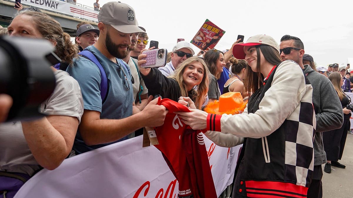 WNBA player Caitlin Clark walking the red carpet at Indianapolis Motor Speedway