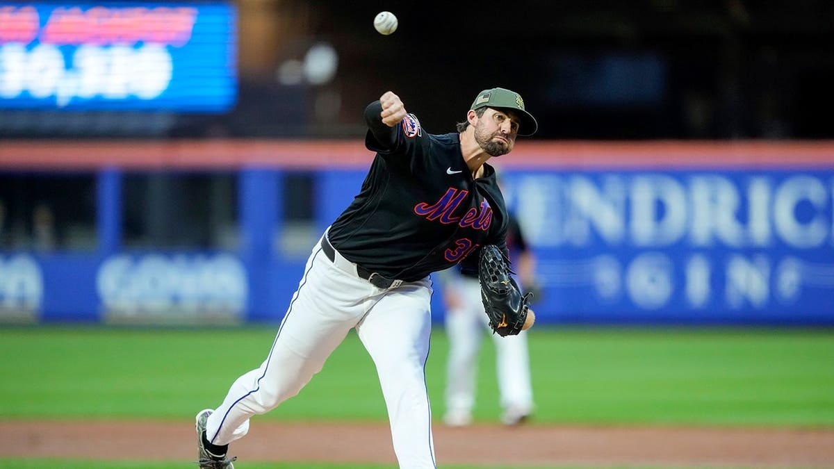 New York Mets pitcher Clay Holmes throwing a pitch during a baseball game