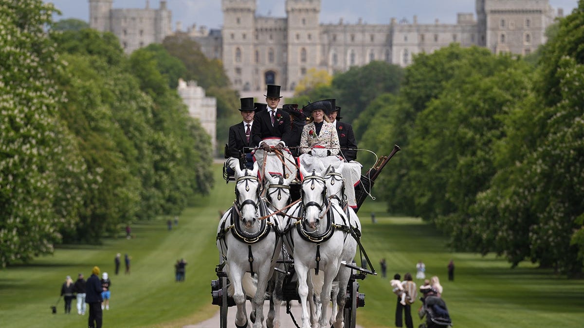 Participants walking up the Long Walk during the Coaching Marathon at Royal Windsor Horse Show