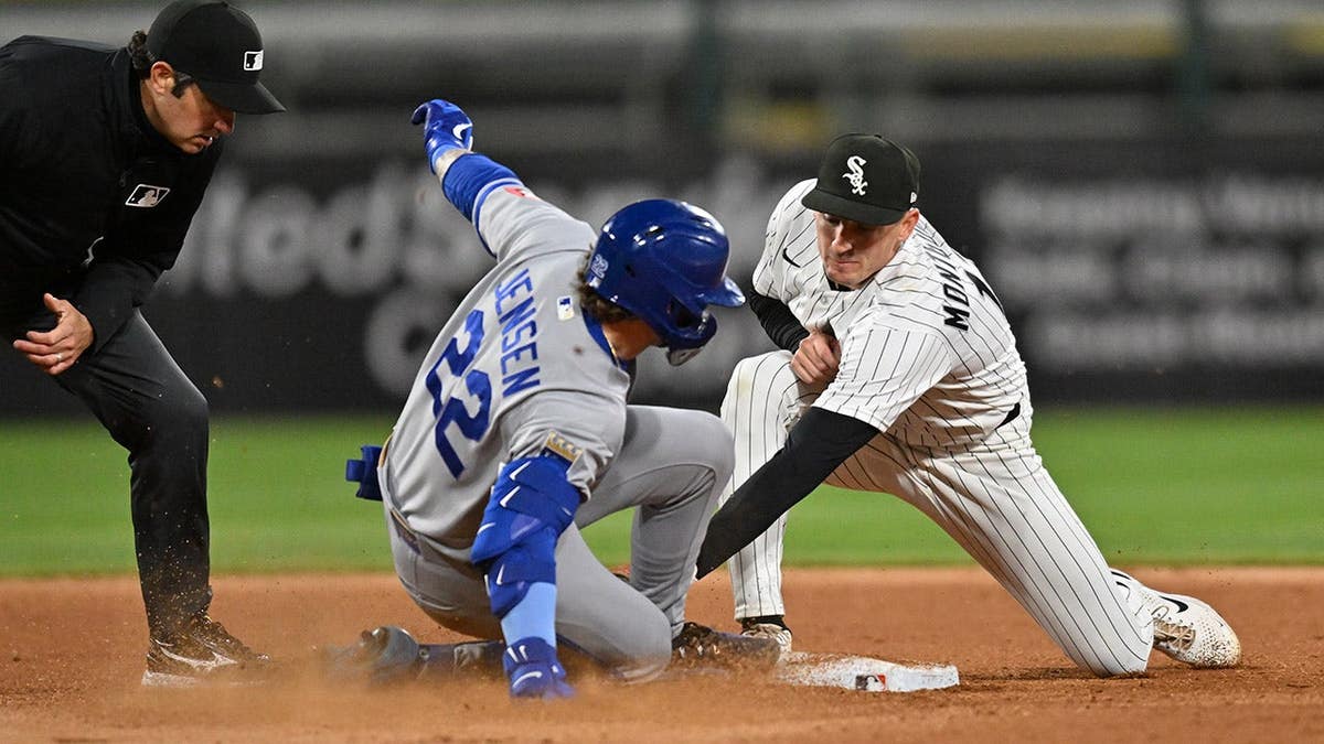 Chicago White Sox shortstop Colson Montgomery tagging Kansas City Royals catcher Carter Jensen at Rate Field