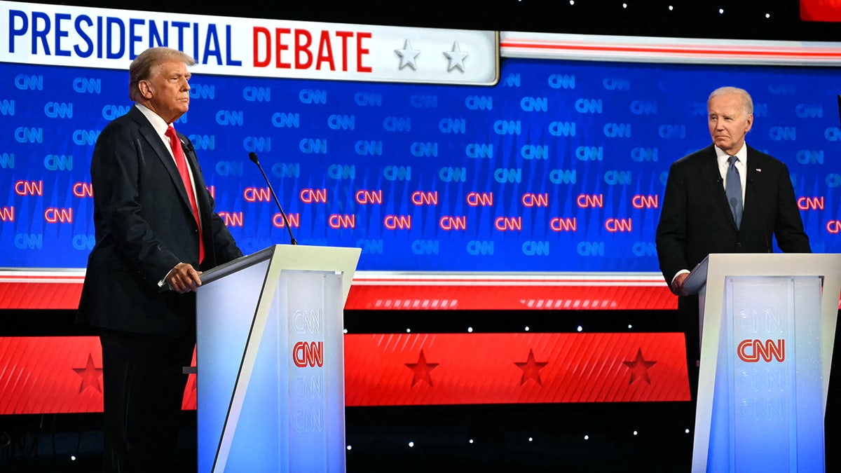 President Joe Biden and former President Donald Trump seated at debate podiums in CNN studios in Atlanta