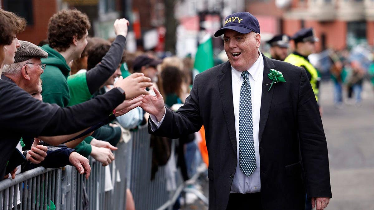 Boston City Councilor Ed Flynn walking in St. Patrick's Day parade in Boston