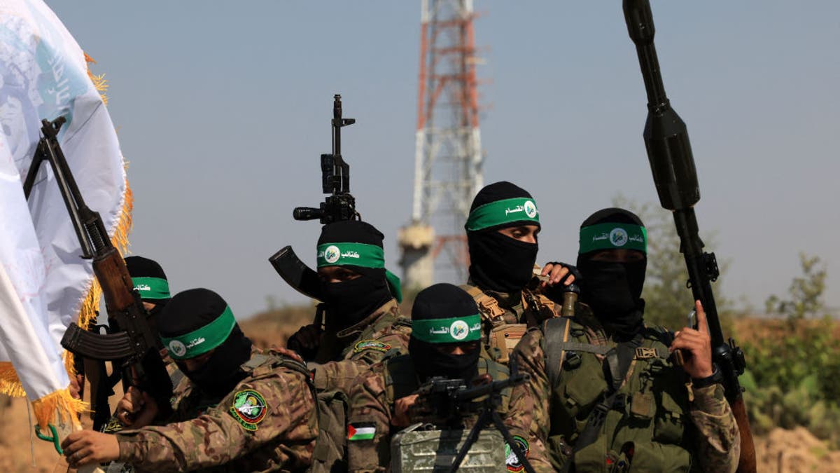 Palestinian Hamas fighters marching in a military parade near the Gaza Strip border