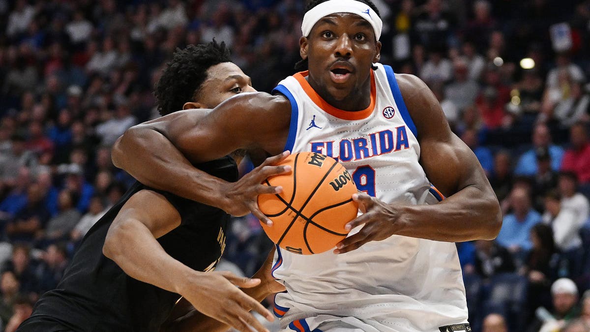 Rueben Chinyelu of the Florida Gators drives into the paint against the Vanderbilt Commodores. (Photo by Carly Mackler/Getty Images)