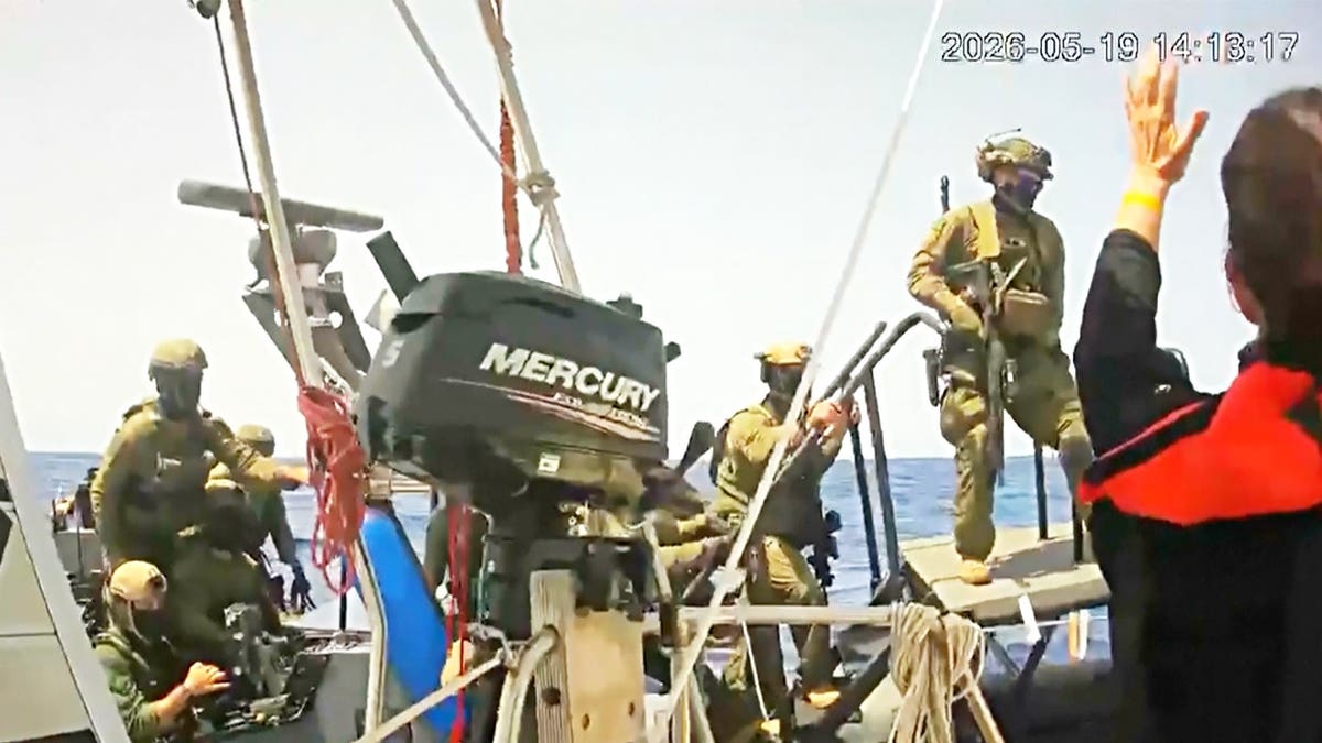 Israeli forces board a boat carrying activists during the interception of the Global Sumud flotilla in the Mediterranean Sea.