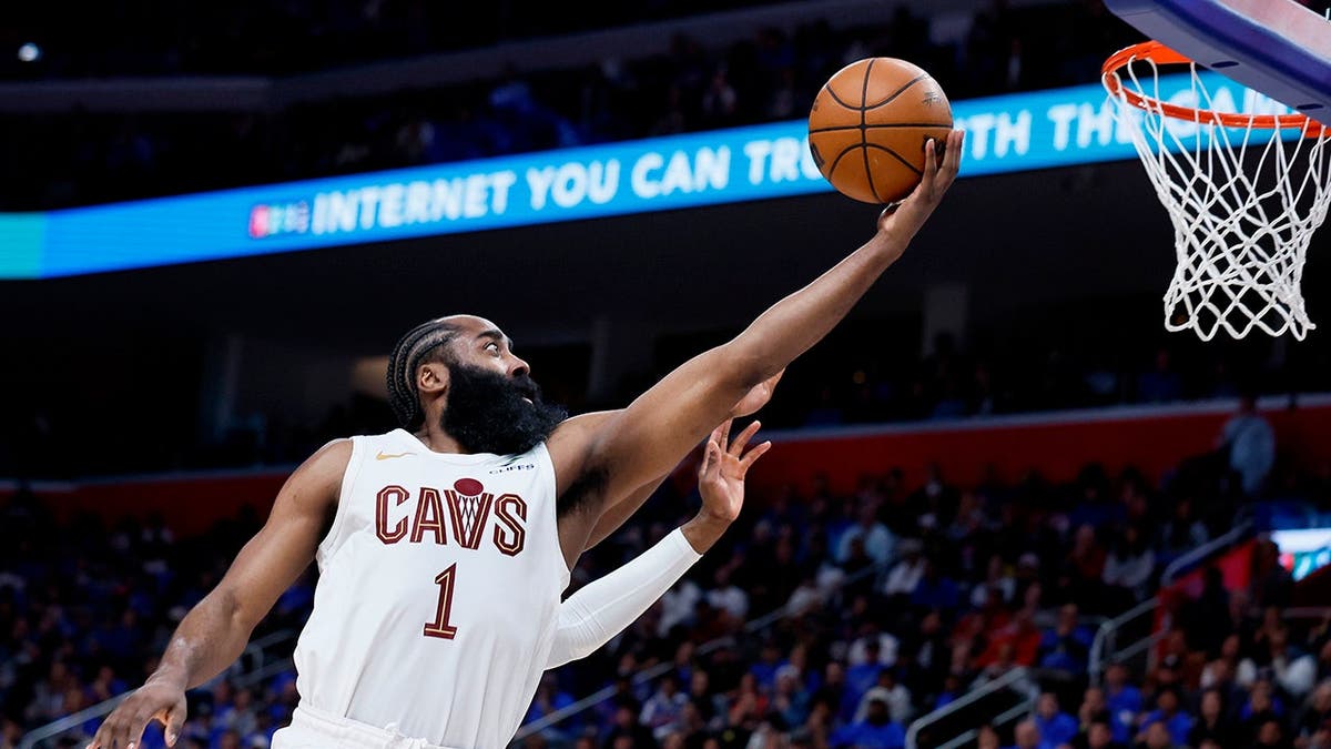 Cleveland Cavaliers guard James Harden driving to the basket against Detroit Pistons players