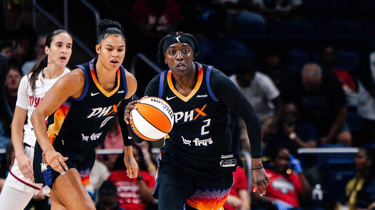 Kahleah Copper dribbling a basketball during a game at CareFirst Arena