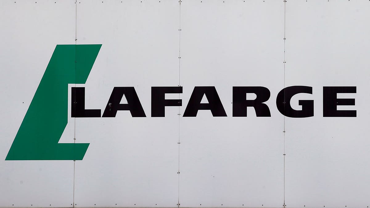 Lafarge logo displayed outside a white facility building