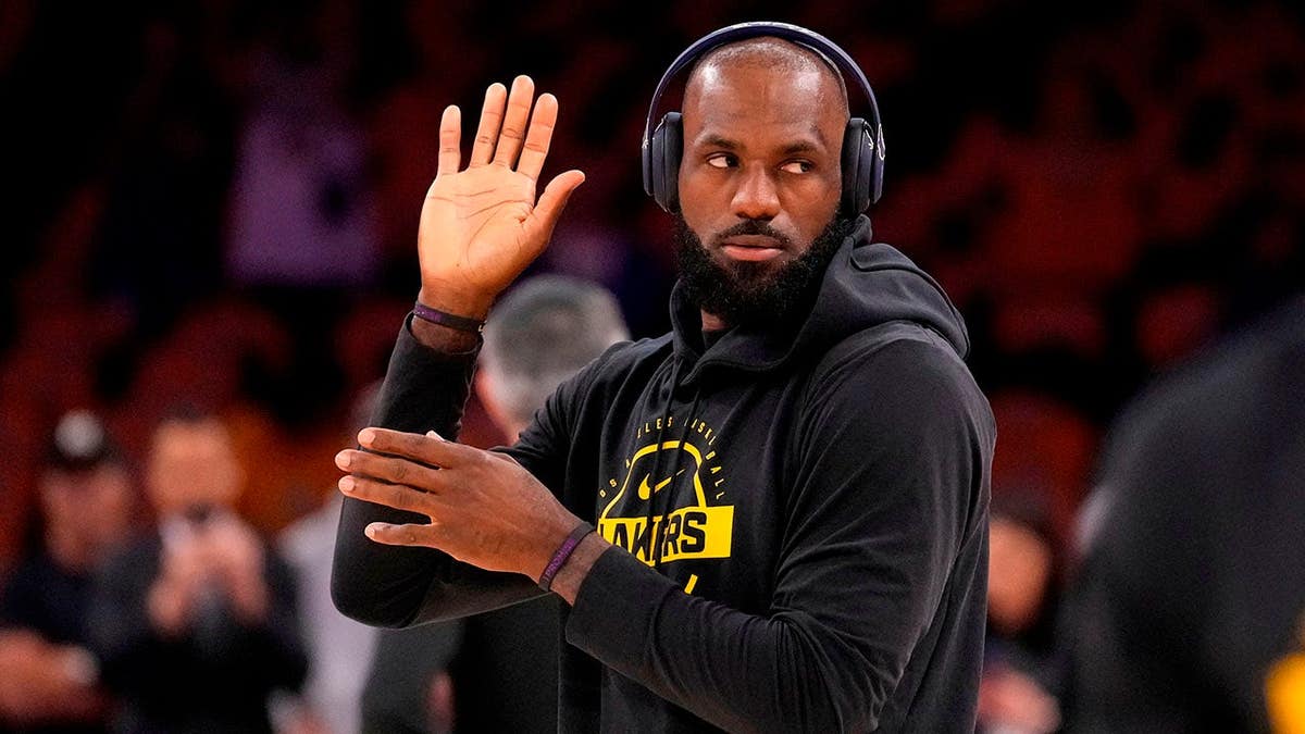 LeBron James walking onto basketball court to warm up