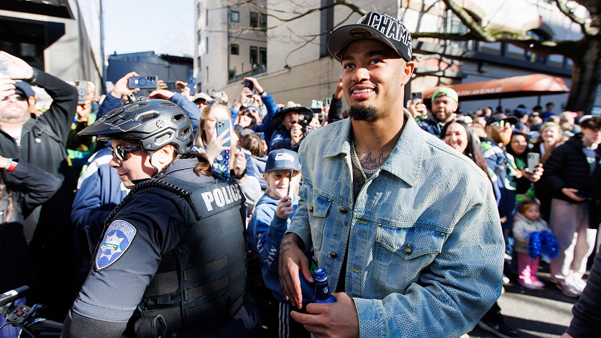 Seattle Seahawks wide receiver Jaxon Smith-Njigba looking on during Super Bowl parade
