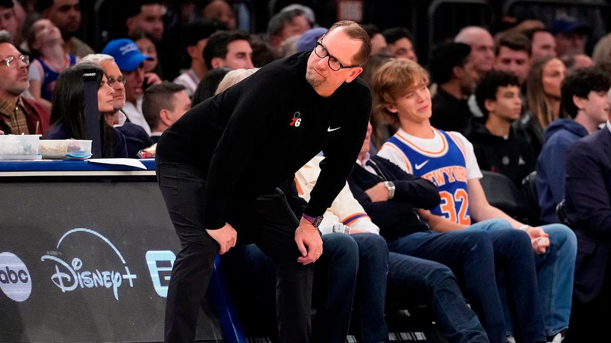 Philadelphia 76ers head coach Nick Nurse watching during NBA playoff game.
