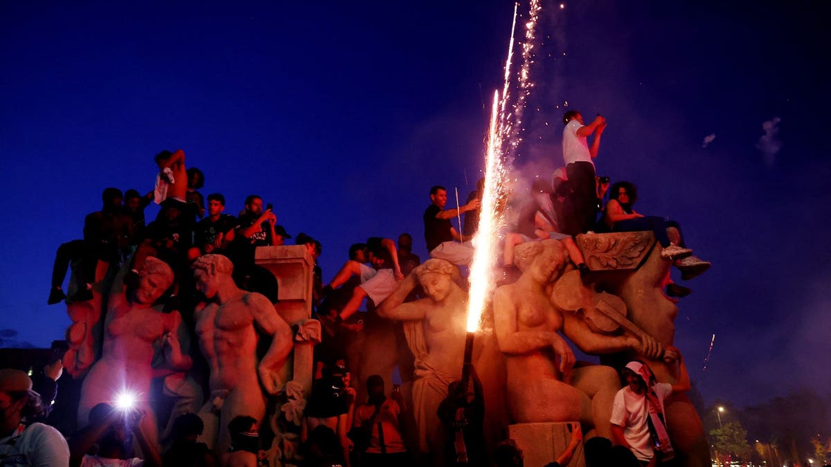Paris St Germain fans celebrate winning the UEFA Champions League