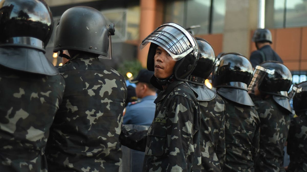 navy personnel lined up during protest