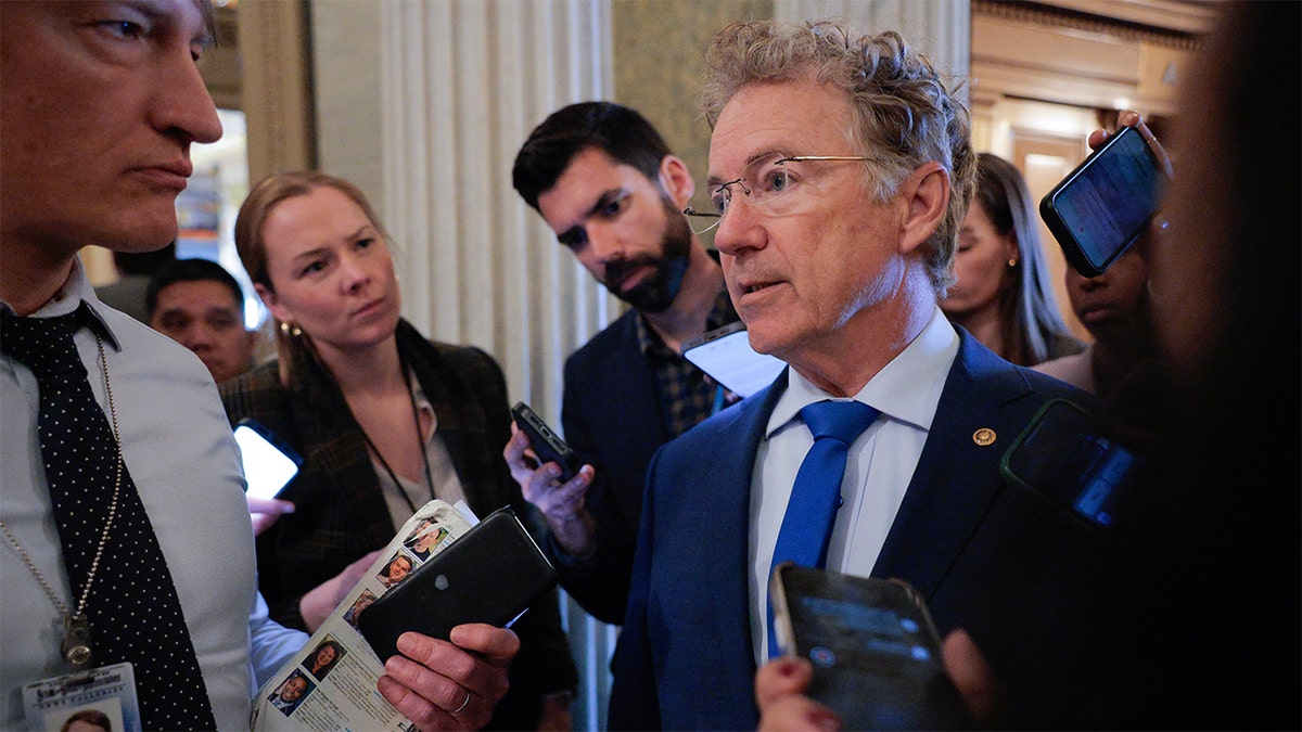 Sen. Rand Paul talking to reporters outside the Senate Chamber at the U.S. Capitol.