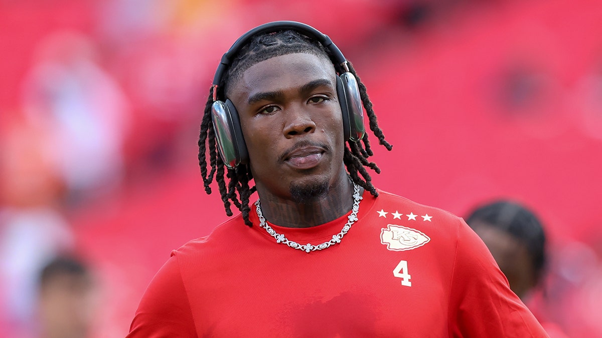 Kansas City Chiefs wide receiver Rashee Rice standing on the field at Arrowhead Stadium.