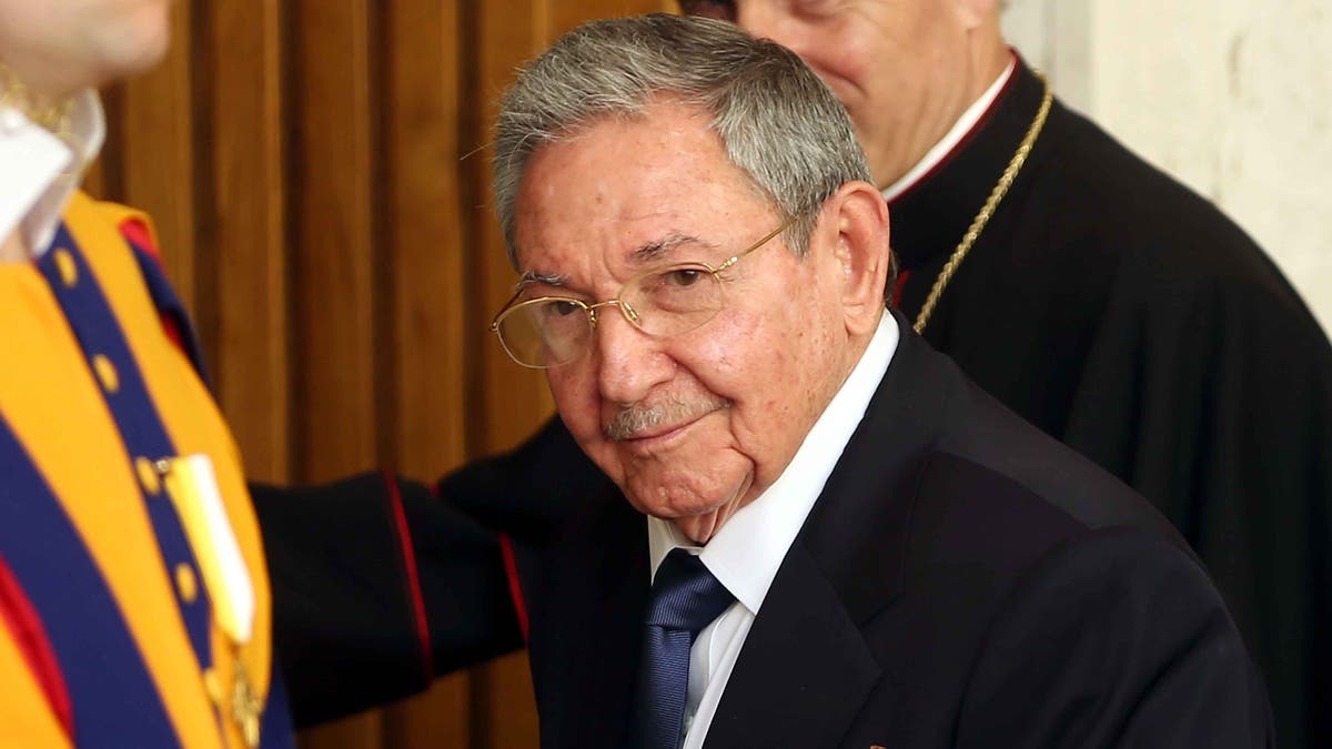 VATICAN CITY, VATICAN - MAY 10: President of Cuba Raul Castro and and Prefect of the Pontifical House Georg Ganswein (R) arrive at the Paul VI Hall private studio for an audience with Pope Francis on May 10, 2015 in Vatican City, Vatican. (Photo by Franco Origlia/Getty Images)