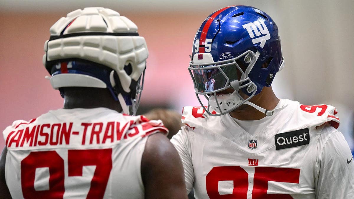 New York Giants defensive tackle Roy Robertson-Harris and defensive lineman Bobby Jamison-Travis participate in a drill