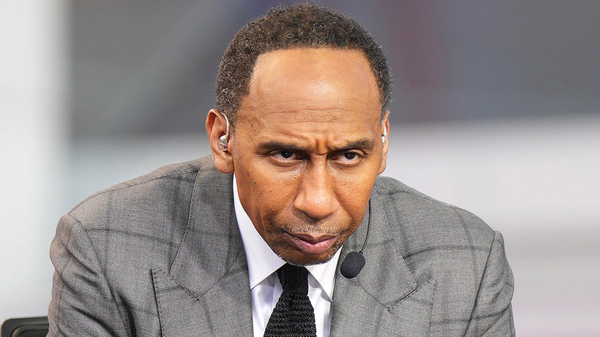 Stephen A. Smith speaking while Ja Morant listens during NBA event