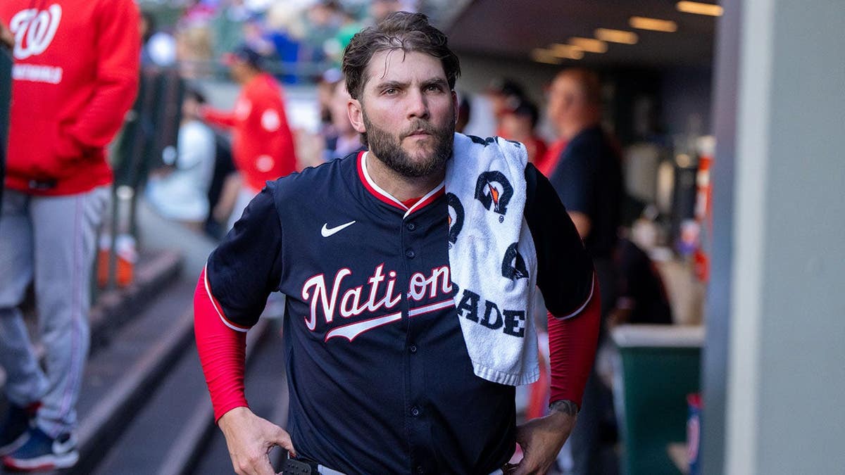 Trevor Williams of the Washington Nationals sitting in the dugout.