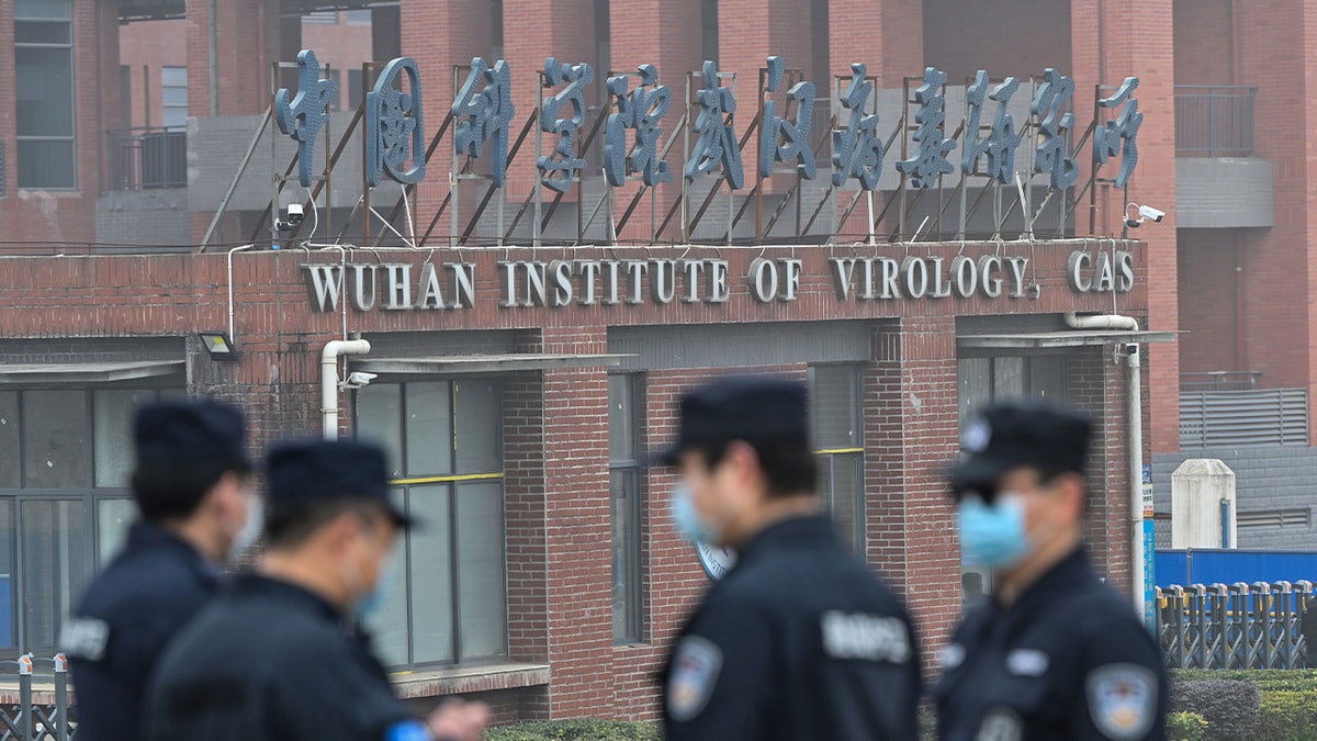 Security personnel standing guard outside Wuhan Institute of Virology in Wuhan