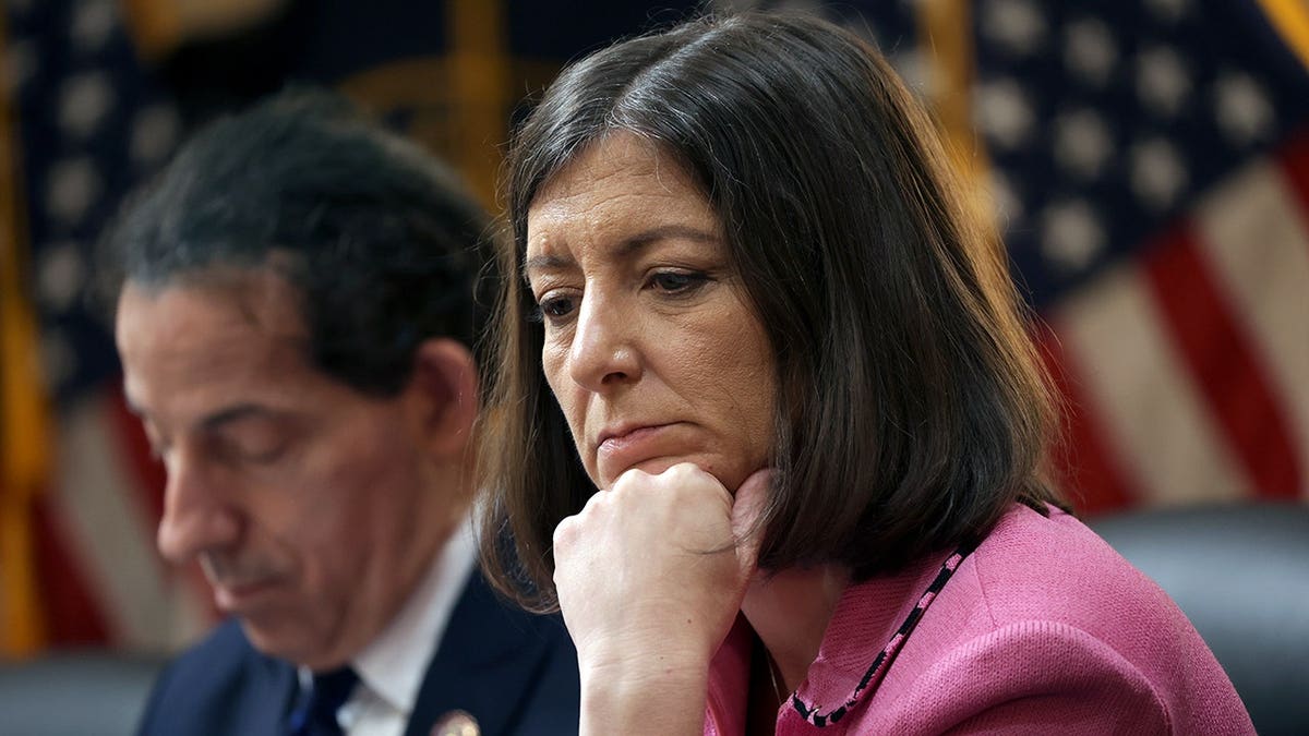 Then-Rep. Elaine Luria sitting on a dais in Congress