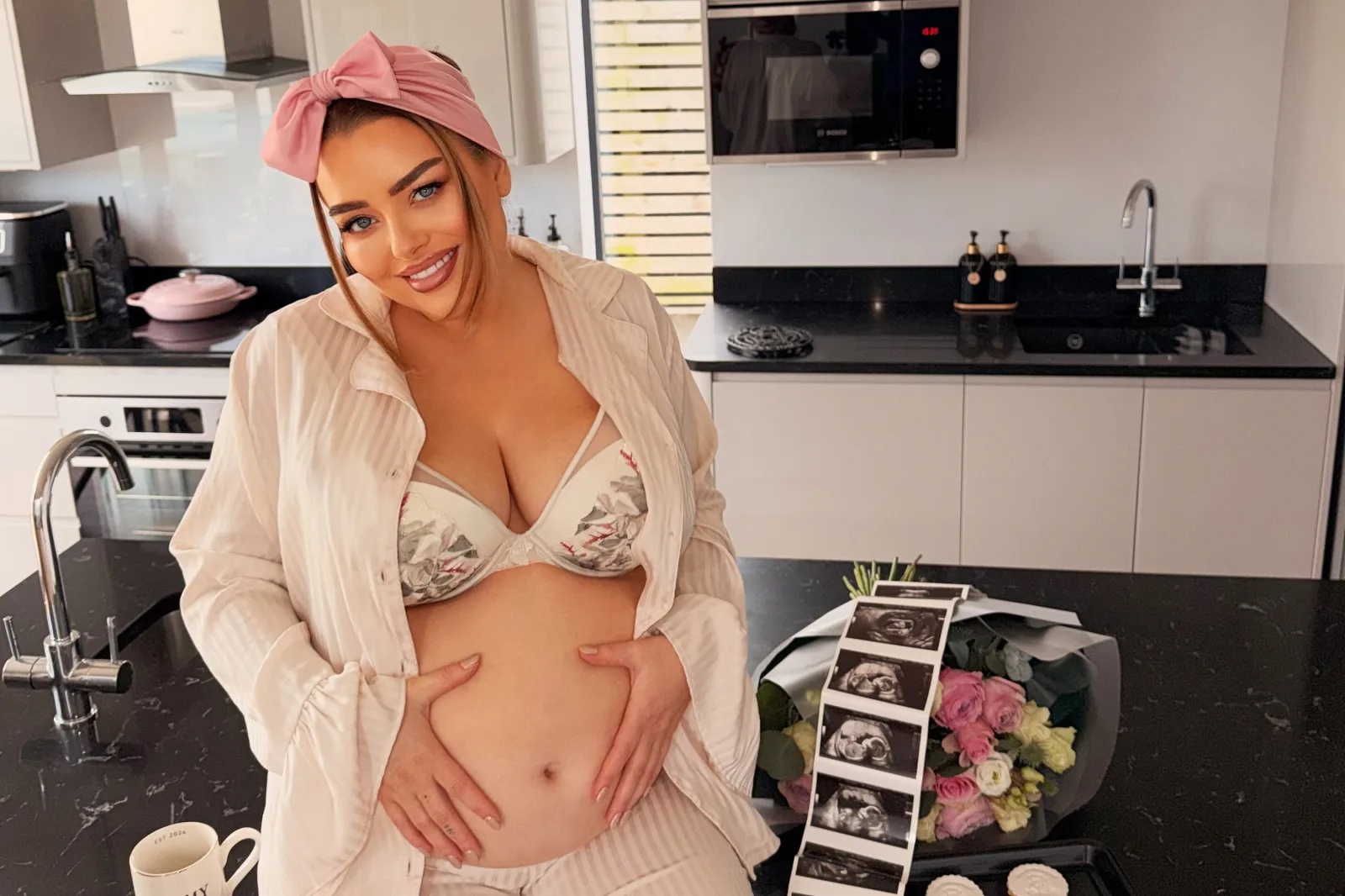 Christophers holding her stomach next to ultrasound scan images.