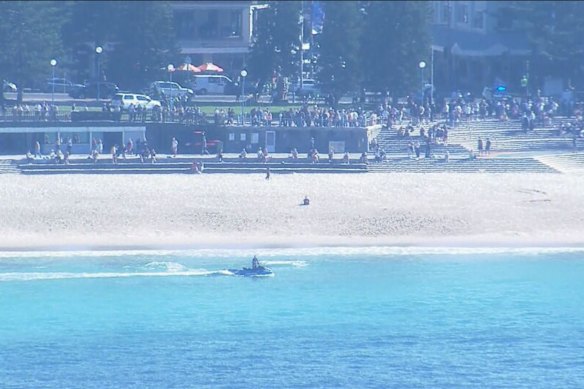 A jet-ski patrols off Coogee Beach after the shark attack.