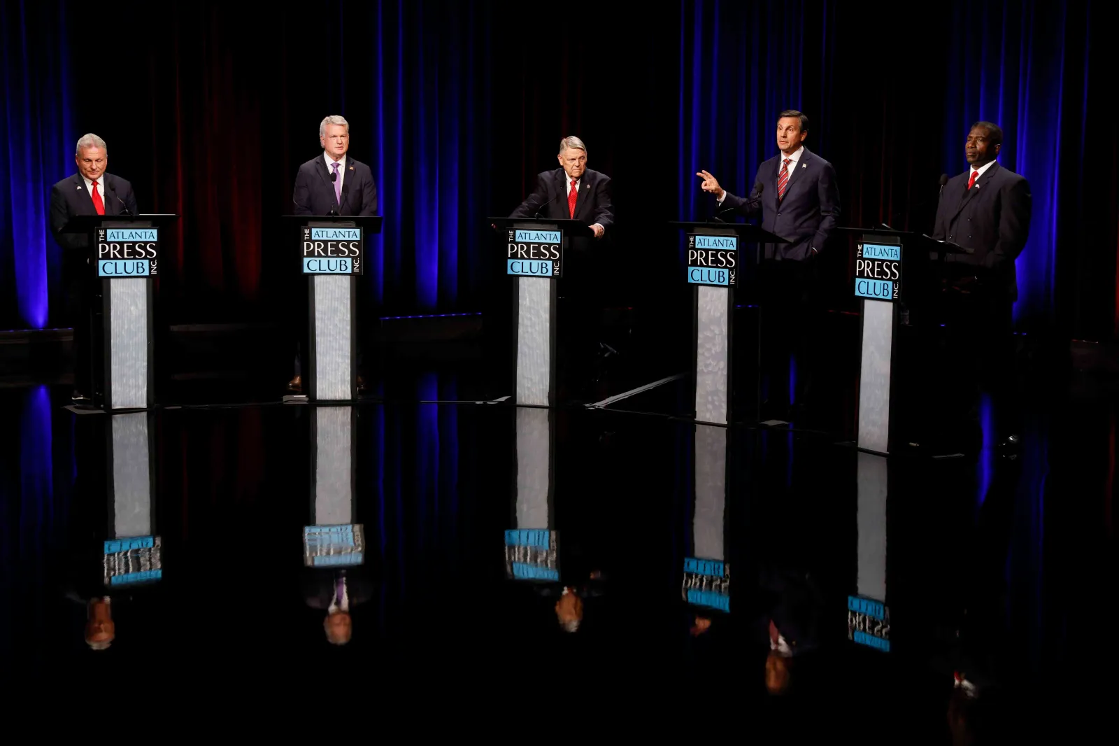 Former football coach Derek Dooley, Republican candidate for U.S. Senate, second right, speaks at the Atlanta Press Club Loudermilk-Young primary election debate on April 26 in Atlanta. (Miguel Martinez/Atlanta Journal-Constitution via AP)