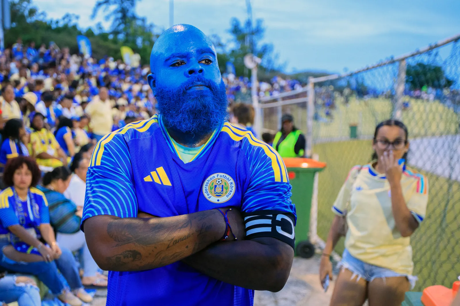 TOPSHOT - Curacao's fan Brenton "Captain Blue Face" Balentien waits for the start of the international friendly football match between Curacao and Aruba at Ergilio Hato Stadium in Willemstad on June 6, 2026. (Photo by Pong Pong / AFP via Getty Images)