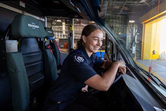 Firefighter Amber Murphy behind the wheel of one of the new state-of-the-art trucks at Western Sydney Airport.