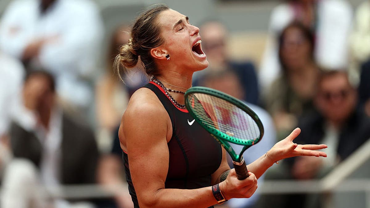 Aryna Sabalenka reacts as she is on the way to being defeated by Diana Shnaider