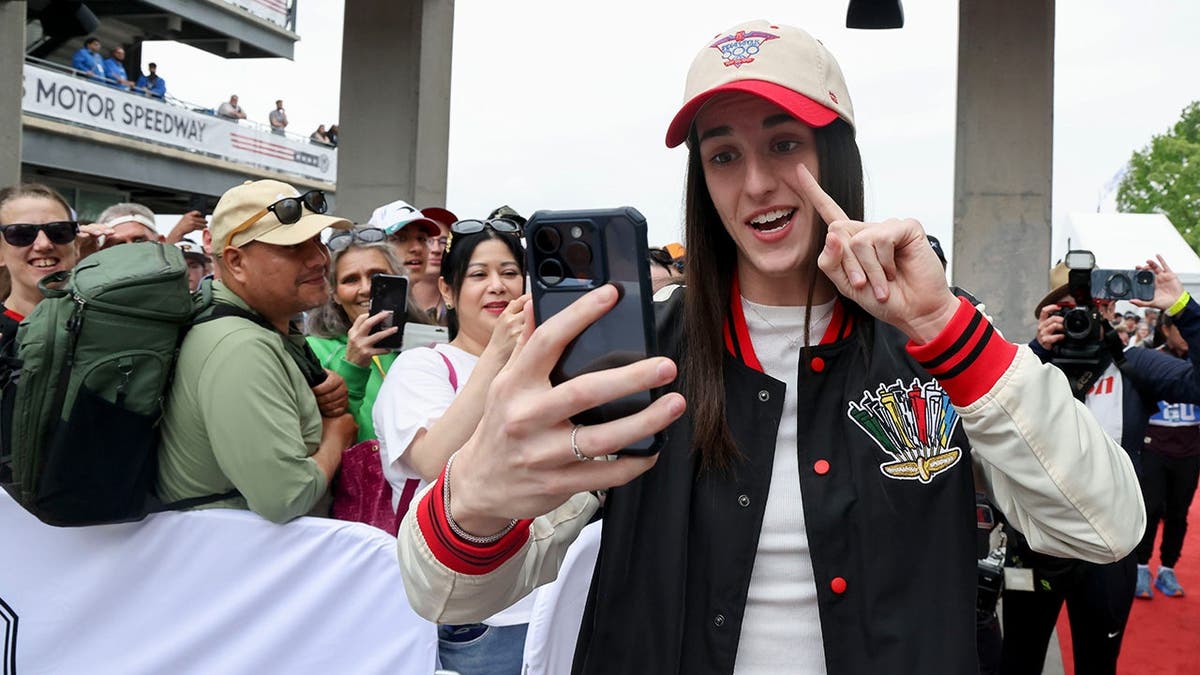 Indiana Fever guard Caitlin Clark walking the red carpet at Indianapolis Motor Speedway
