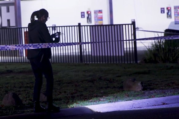A police investigator at the Melton crime scene on Thursday morning.