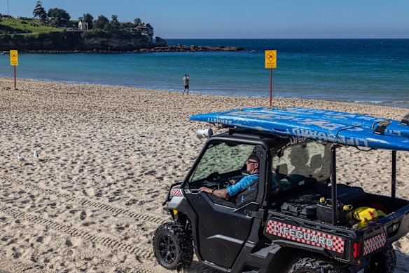 Lifeguards patrol Coogee in the hours after the attack. The beach has now reopened.