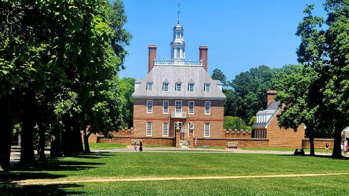 The Governor's Palace sits behind a large lawn.