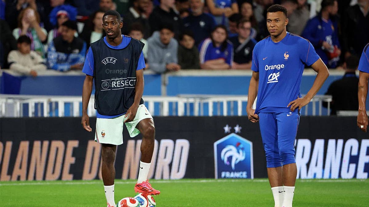 Ousmane Dembélé #7 and captain, Kylian Mbappe #10 of Team France