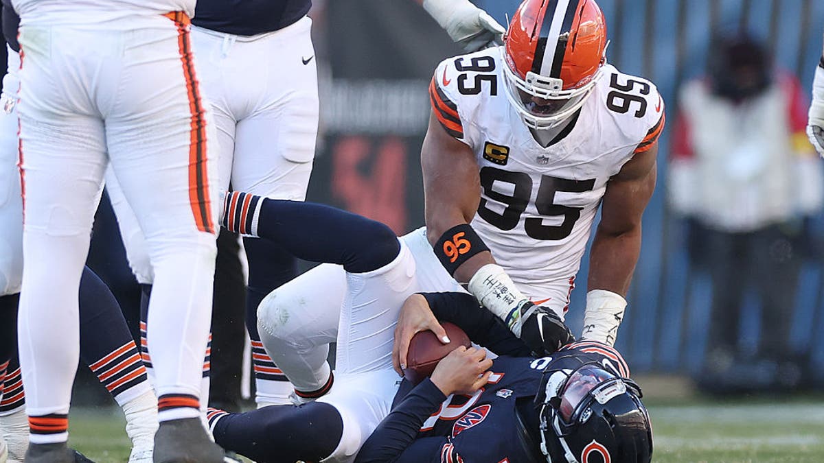 Myles Garrett #95 of the Cleveland Browns sacks Caleb Williams #18 of the Chicago Bears at Soldier Field on December 14, 2025 in Chicago, Illinois. (Photo by Michael Reaves/Getty Images)
