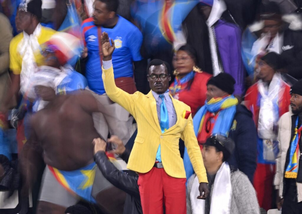 Why Does ‘Lumumba Vea,’ DR Congo’s ‘Statue Man,’ Stand The Whole Match?