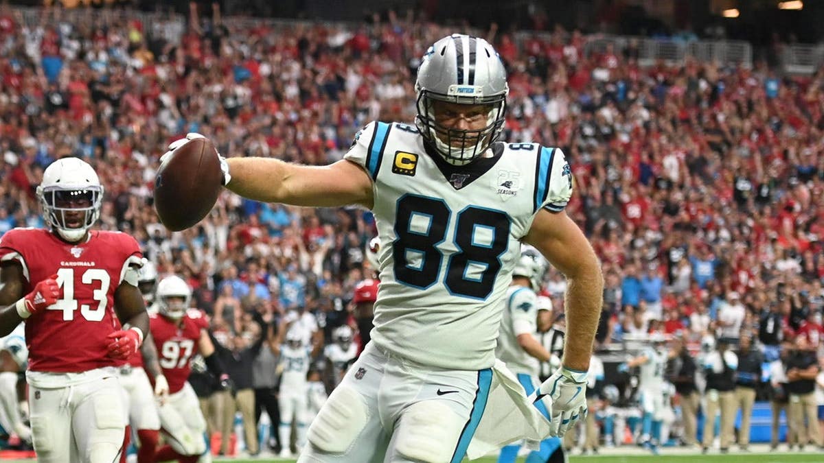 Carolina Panthers Greg Olsen scoring a touchdown at University of Phoenix Stadium.