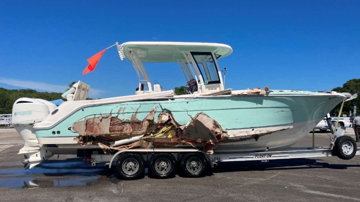 George Pino standing near his boat that crashed into a channel marker