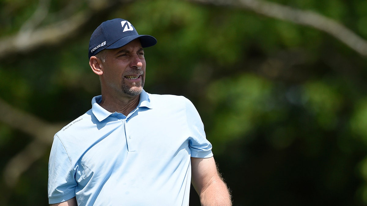 John Smoltz watching his tee shot on the second hole at University Ridge Golf Course