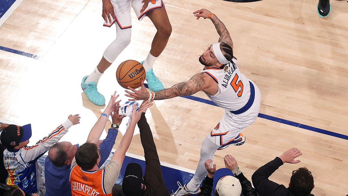 Jose Alvarado holding basketball inbounds during NBA Finals game at Madison Square Garden