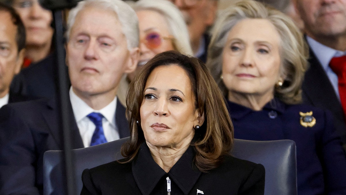 Former President Bill Clinton, former Vice President Kamala Harris, and former Secretary of State Hillary Clinton standing in the U.S. Capitol rotunda