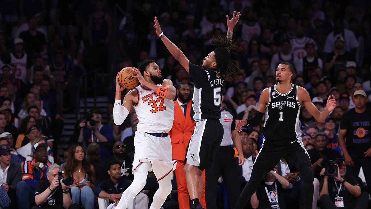 Karl-Anthony Towns defending Stephon Castle during NBA Finals game at Madison Square Garden