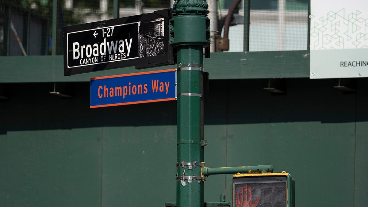 A street sign reading Champions Way posted along Broadway in New York.